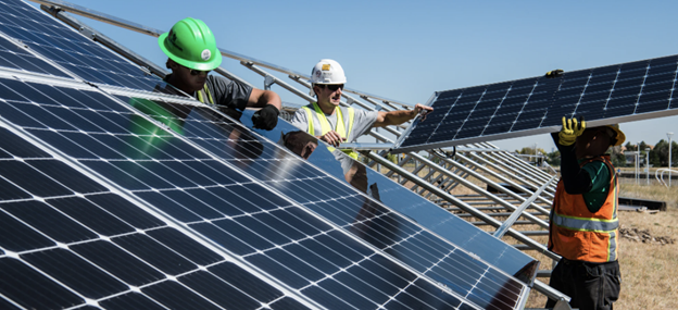 Photo of people installing solar panels